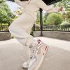 Li Ning Daily Prosperity Series однотонные повседневные трикотажные спортивные брюки с манжетами женские брюки цвета не совсем белого AKLU028-4