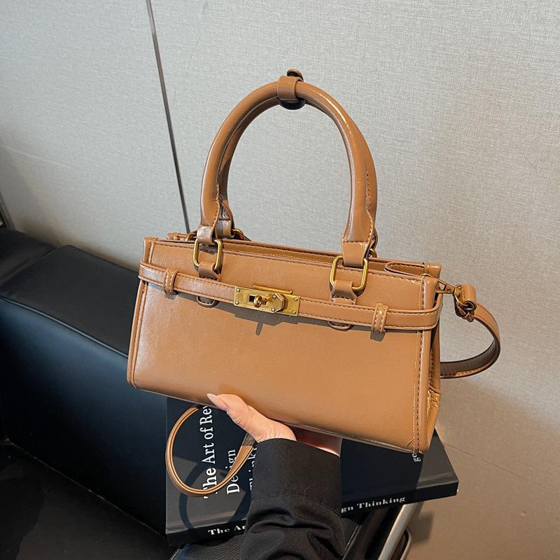 Корейская версия простой и универсальной нишевой портативной сумки-мессенджера для поездок на работу, женская, новая коллекция осень-зима 2025, высококачественная текстурированная сумка-тоут