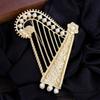 Diamond-Encrusted Pearl Sub-Gold Three-Dimensional Harp Brooch, Alloy Hollow Musical Instrument, French Niche Pin, Clothing Accessories
