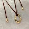 Женское черное ожерелье с подвеской из веревки - Металлический круг Дун Цзе, Длинная цепочка для свитера, Винтажный роскошный стиль