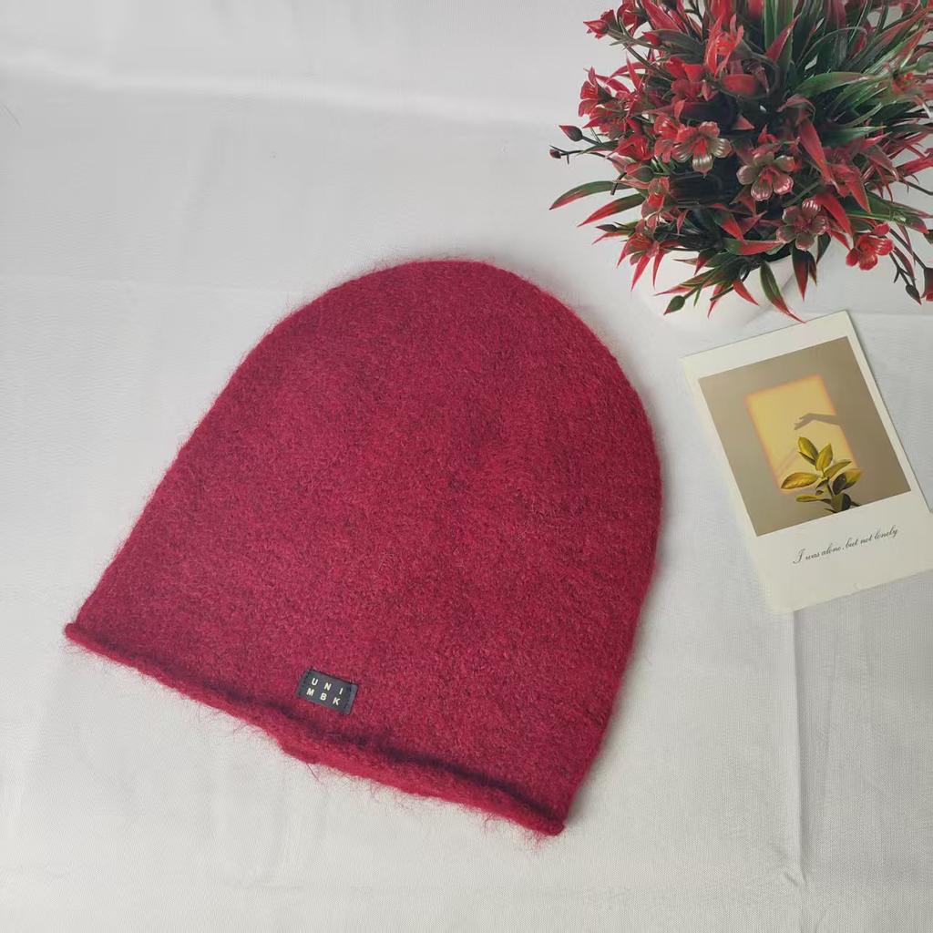 Trendy solid color versatile plus stacked hats show your face small cold hats autumn and winter warm ear protectors knitted wool hats