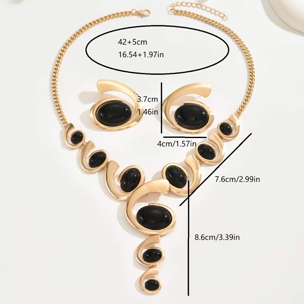 Комплект женских украшений в стиле бохо-шик: Узор в виде спирали-улитки с черными стразами. В комплект входит Y-образное ожерелье и серьги-гвоздики. Идеально подходит для повседневного и праздничного образа.