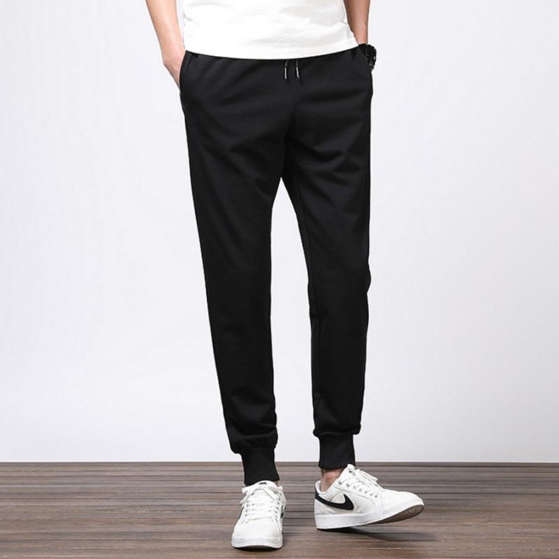 Повседневные брюки мужские летне-осенний тренд зауженные большого размера показывающие рост свободные жир однотонные спортивные на резинке девятиточечные брюки универсальные