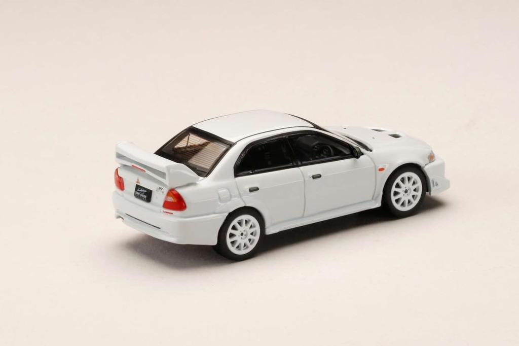 Mitsubishi Lancer RS Evolution 6 Шотландия Белый 1/64 (ТМЕ)
