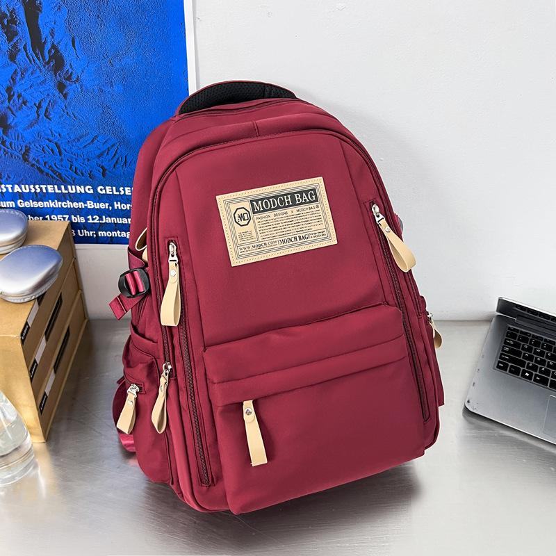 Schoolbag is specially designed for new schoolbags, female students, nylon retro simple, junior high school students, male large-capacity couple .