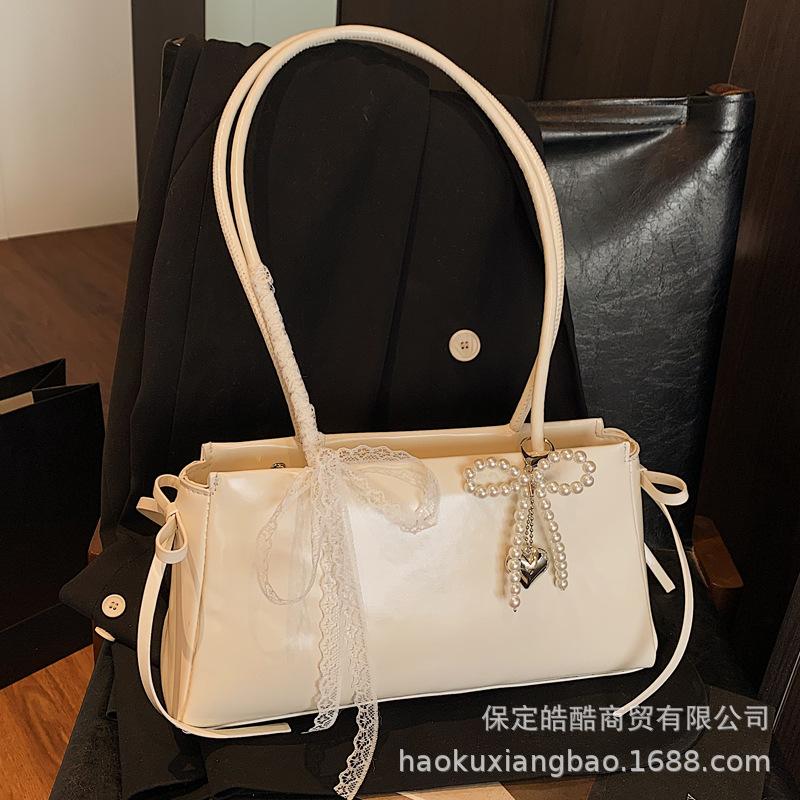 Корейская милая сумка подмышку для девочки 2025 новая модная сумка-подушка с бантом премиальная текстура универсальная сумка через плечо