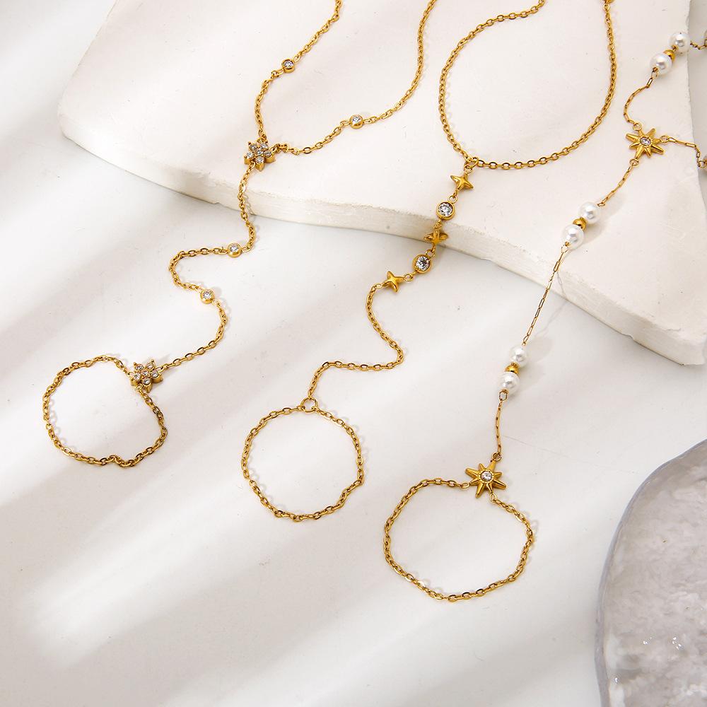 Exquisite and elegant 18K gold-plated zircon-inlaid mango geometric stainless steel integrated finger bracelet, back chain.