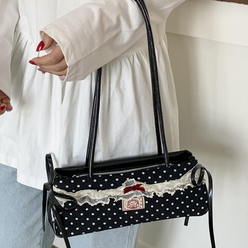Летняя новая портативная наплечная сумка, высокая ценность, маленькая сумка в черно-белый горошек, модная сумка для通勤 для женщин