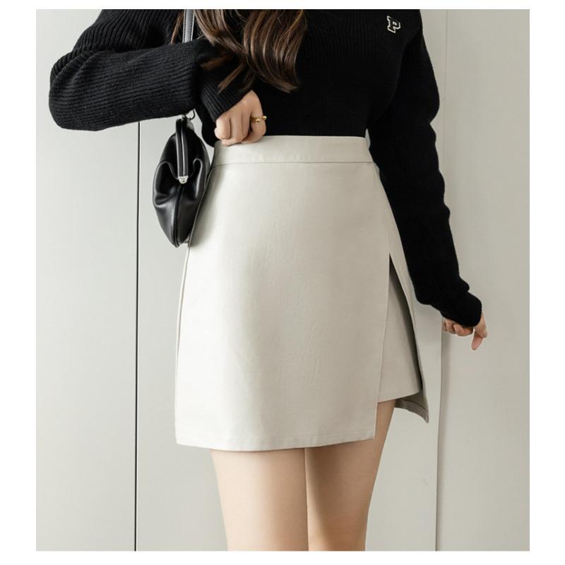 Осенне-зимняя женская юбка из искусственной кожи, короткая юбка, нерегулярная открытая вилка, тонкий дизайн, высокая талия, посылка на бедрах