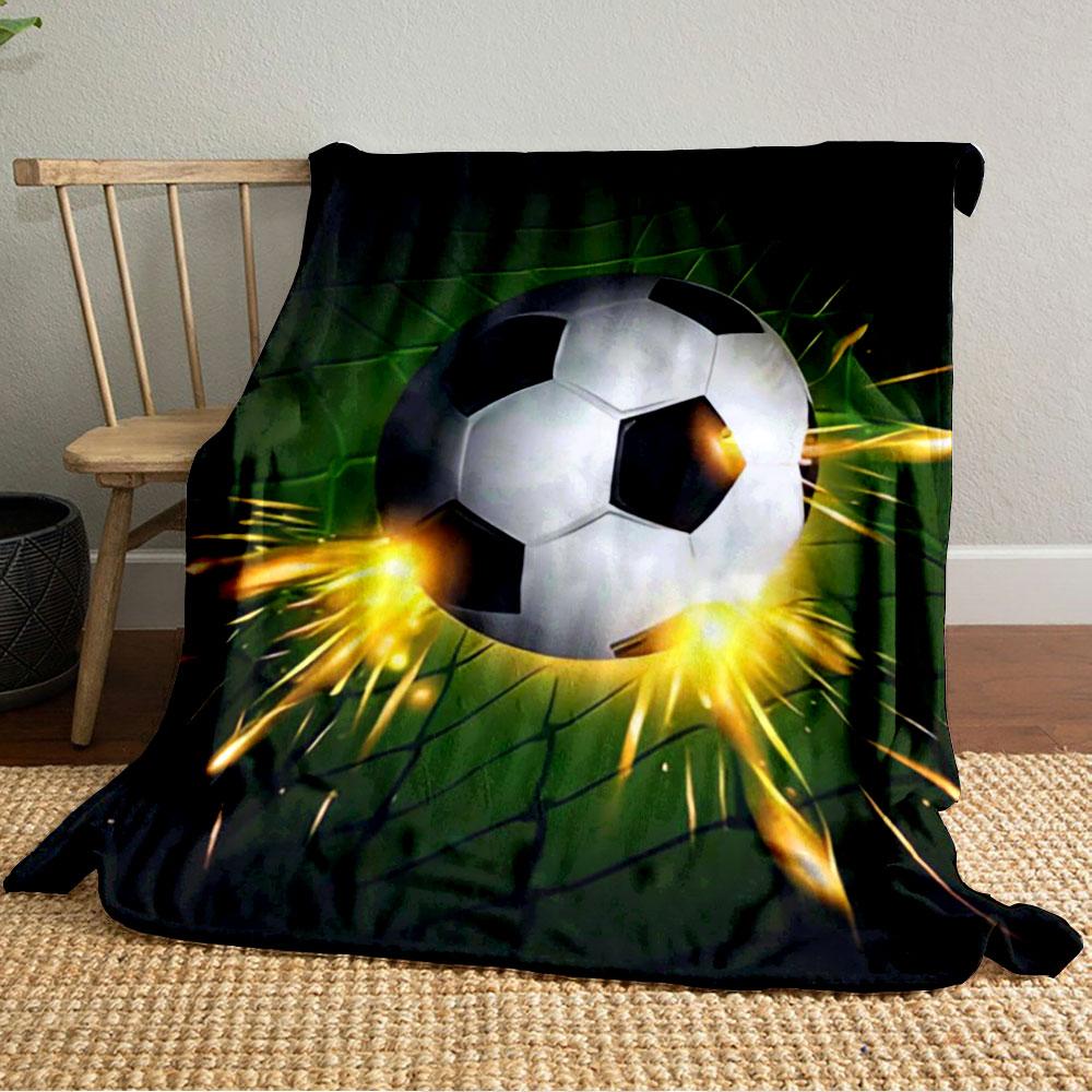 A soccer ball hitting a green net with bright orange sparks. for all seasons blanket lunch break throw gift