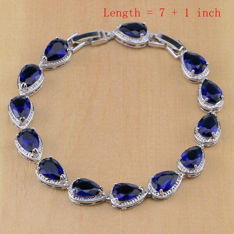 Набор ювелирных украшений под серебро с камнями синего цвета каплевидной формы по центру и мини стразами вокруг