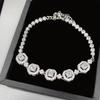 Браслет Versa Simulation Jewelry с микро-вставками зеленых бриллиантов, покрытие белым золотом, разноцветный, ручная работа, женский