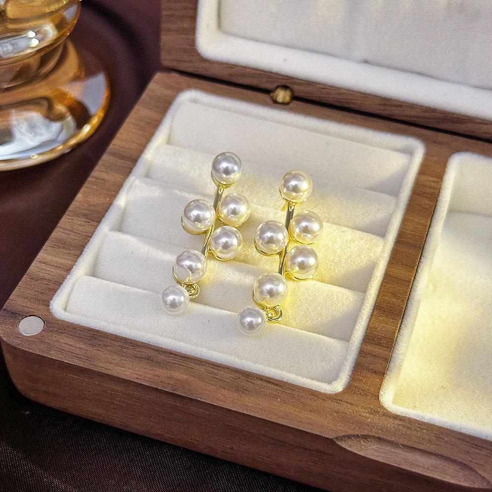 «Серьги-бантики из серебряных игл с жемчугом и цирконием»: Нишевый дизайн, стильный и универсальный, легкий роскошный аксессуар высокого класса.