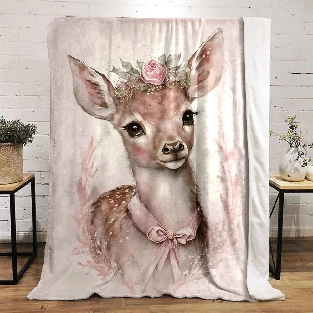 A delicate fawn adorned with a floral crown and pink ribbon on its neck. for all seasons blanket lunch break throw gift