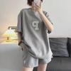 Women's 2023 Summer Casual Fashion Loose Sports Letter Two-Piece Set with Short-Sleeve Top and Shorts.