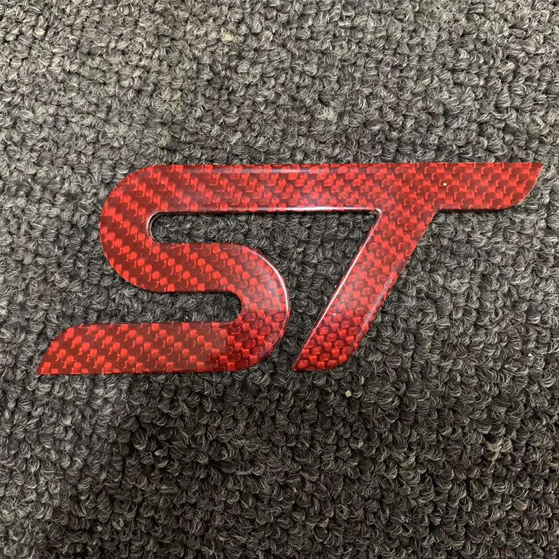 Car logo real carbon fiber ST logo m logo is applicable to Ford focus MK1 MK2 MK3 MK4 ST RS