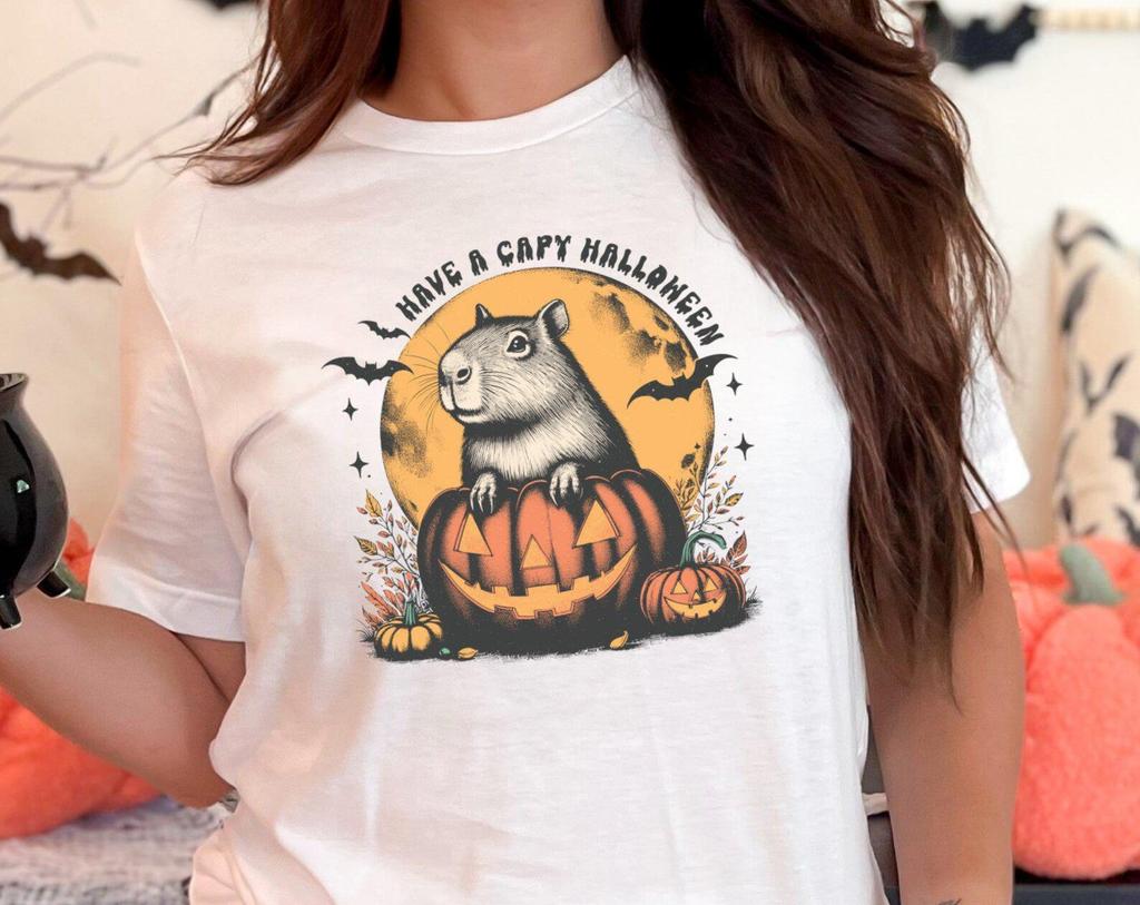 Cute Capybara Halloween T-Shirt and kids tshirt Funny Animal Pumpkin Design Perfect for Halloween Lovers and Capybara Fans Unique Halloween Tee