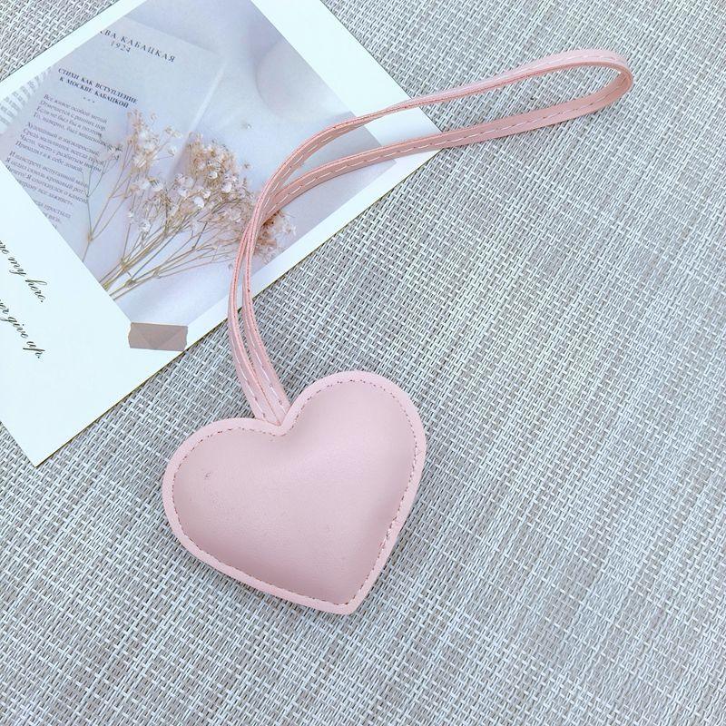 New niche leather peach hand rope pendant simple bag pendant car couple backpack accessories fashion Bag Charm