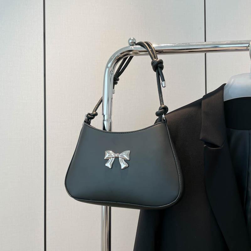 Осень новая нишевая сумка через плечо милая и свежая сумка подмышку с бантом для通勤, темпераментная ручная сумка