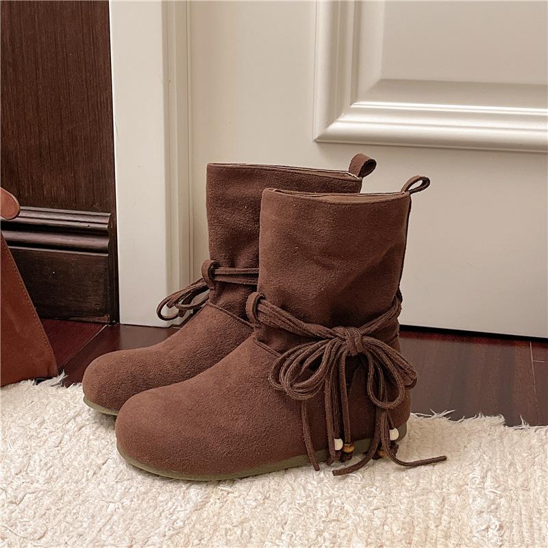 Модные женские ботильоны на шнуровке 2025 Осень Мода Замшевая плоская подошва Повседневные Челси Короткие ботильоны Ретро Кисточка Бант Боты Женские