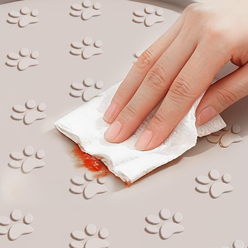 1pc Plastics Pet Feeding Mat |, Leakproof, Non-Slip, Oval Dog and Cat Food Mat for Dogs and Cats,Footprint Texture Feeding Pad
