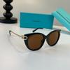 Женские роскошные солнцезащитные очки Tiffany & Co формы «кошачий глаз» в черной оправе с золотым звеньями
