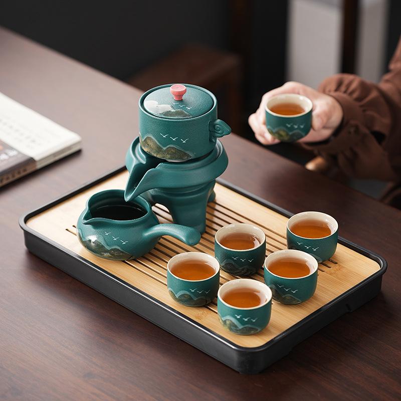 New Chinese teapot coarse pottery automatic kung fu tea set lazy tea business souvenir anti-scalding stone grinding tea set