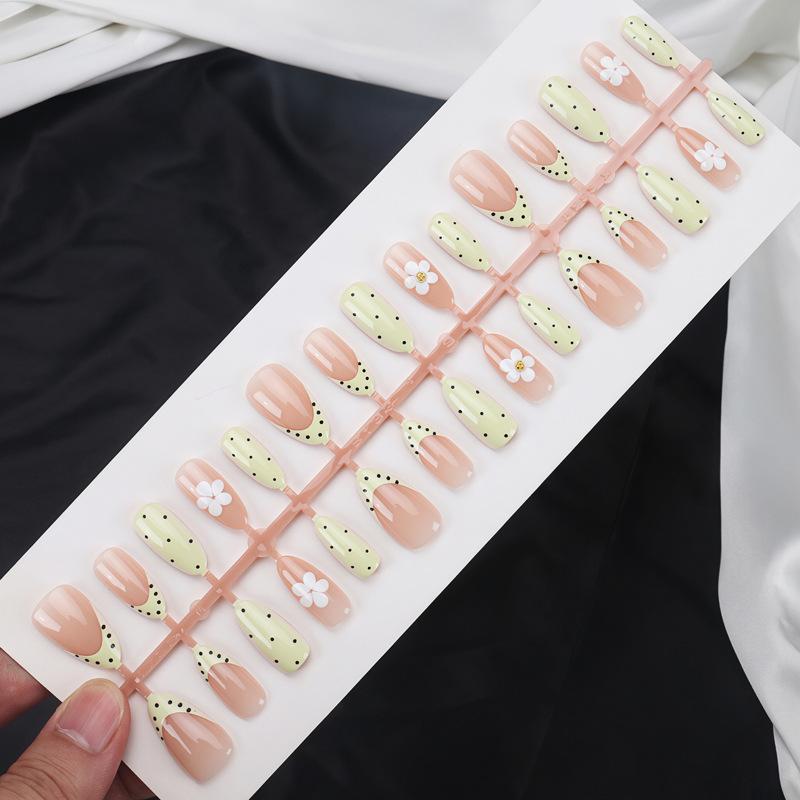 Wearable Manicure With Embossed White Flowers, Small Black Polka Dots, Creamy Yellow French Edge Manicure, Fresh And Age-reducing Fake Nails