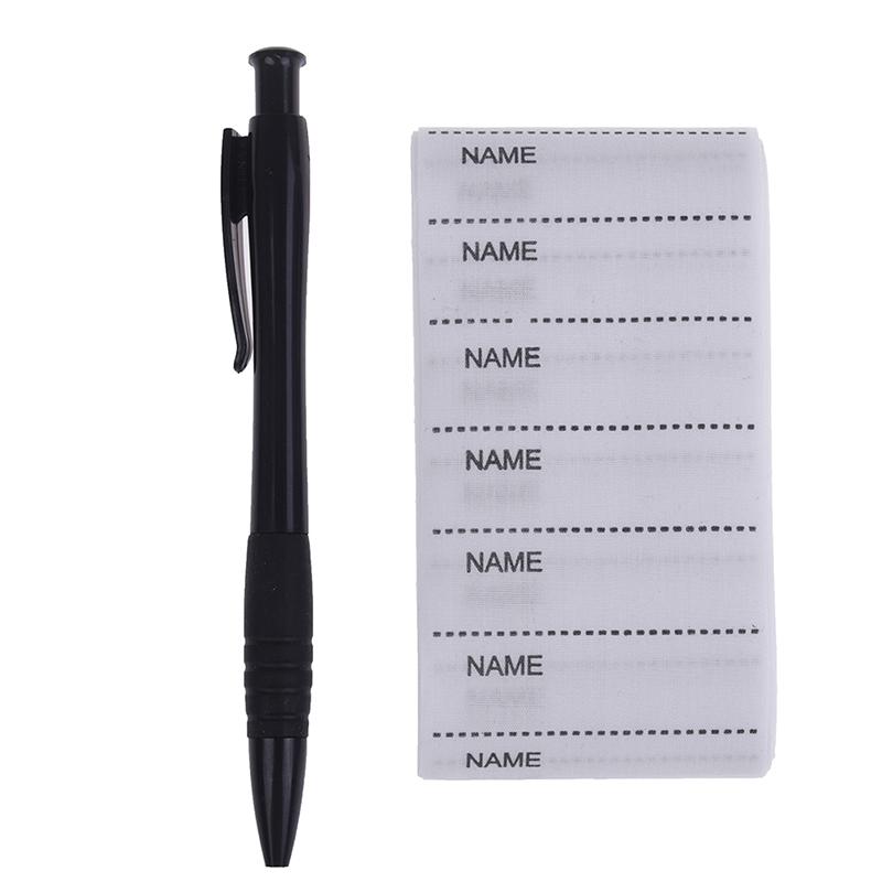 Белый моющийся утюг на наборе маркеров бирок ткани одежды ярлыков имени для одежды