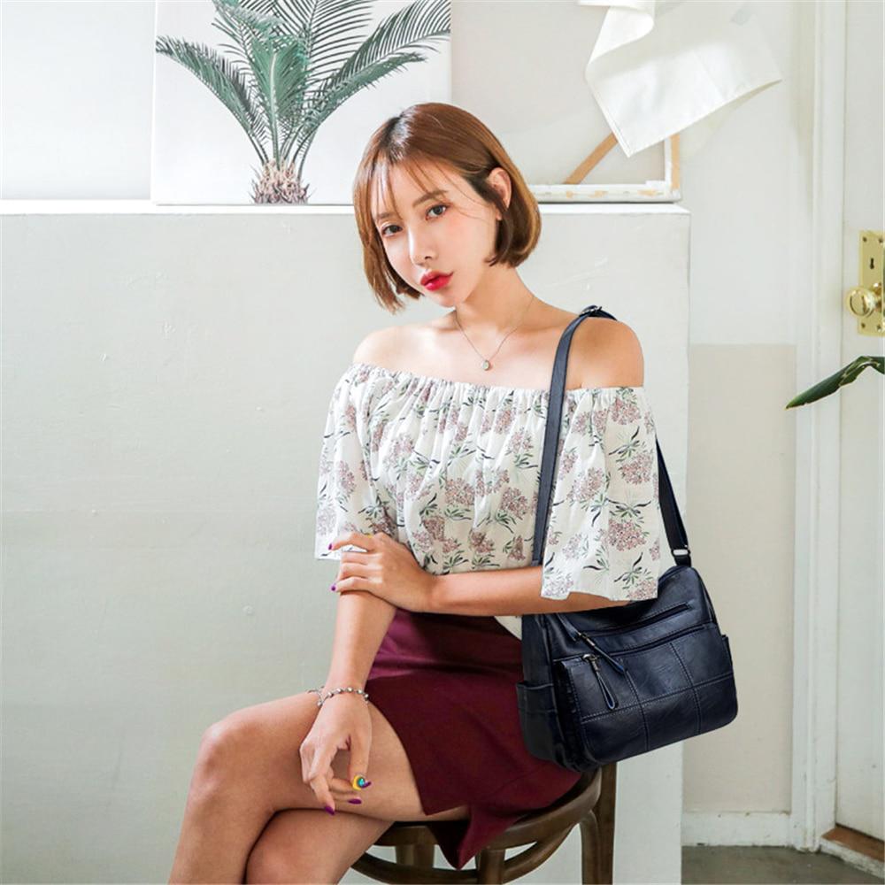 Женская кожаная сумка на ремне