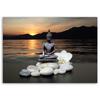 Canvas print, Buddha on a background of a setting sun