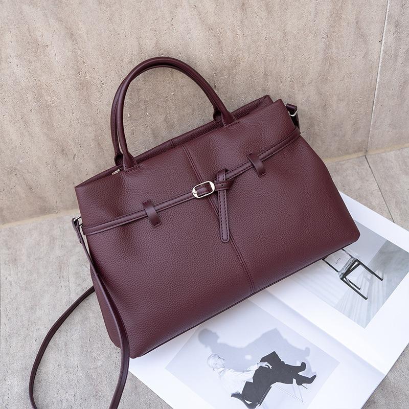 Винтажная кожаная женская сумка, новая вместительная сумка-платина для通勤, женская сумка через плечо, портативная сумка-тоут.