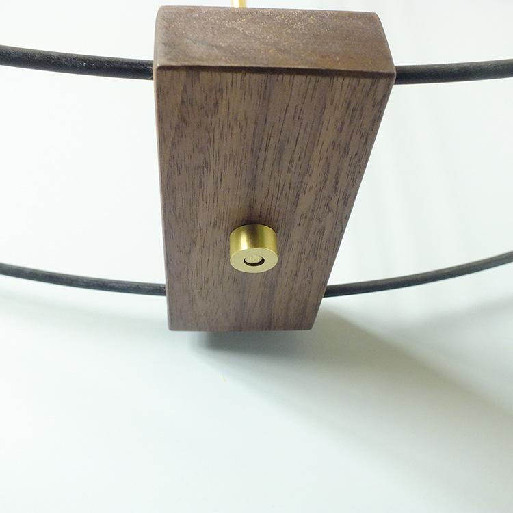 Nordic Modern Minimalist Spanish Nomon Wall Clock, Black Walnut with Large Copper Pointer for Hotel and Living Room Decor.