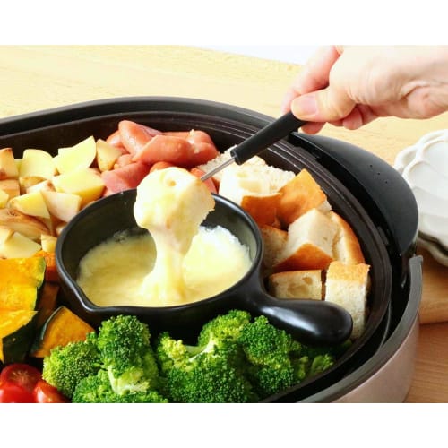 A stylish, black, 12cm small, heat-resistant, ceramic skillet for ajillo, microwave, oven, and stovetop use. Made in Japan by Banko ware.