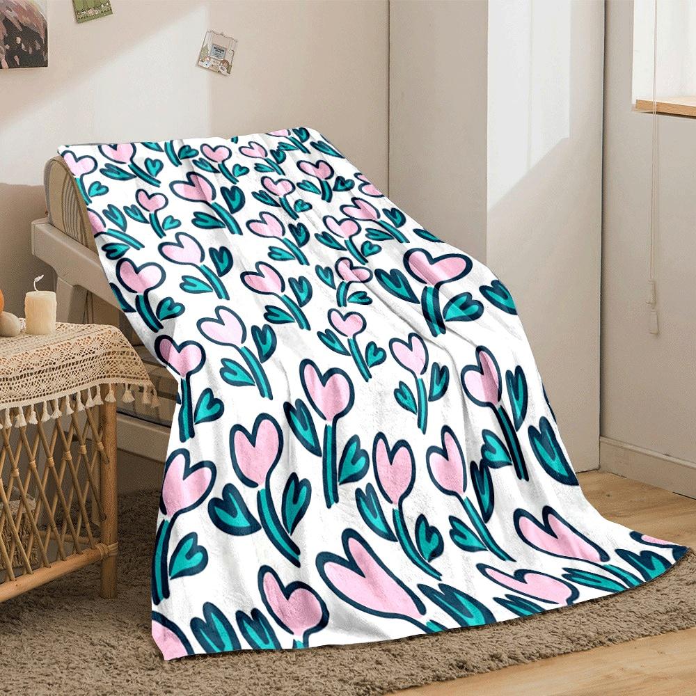 Pink heart-shaped flowers with teal leaves on a white background. for all seasons blanket lunch break throw gift