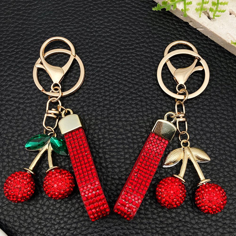 Большой брелок-вишня из смолы со стразами и золотым кольцом