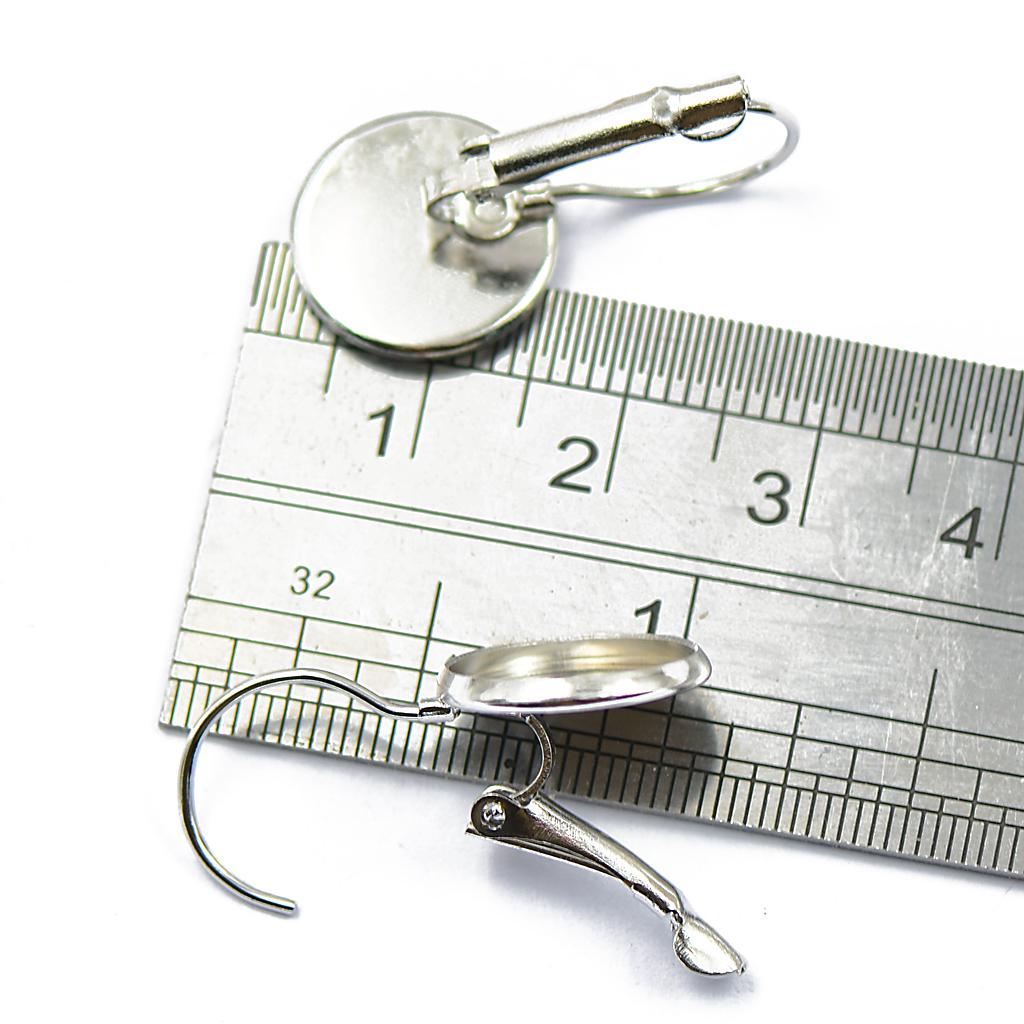 24 шт. Заготовки для сережек с французским рычагом на спине подходят для сережек с кабошонами диаметром 12 мм.