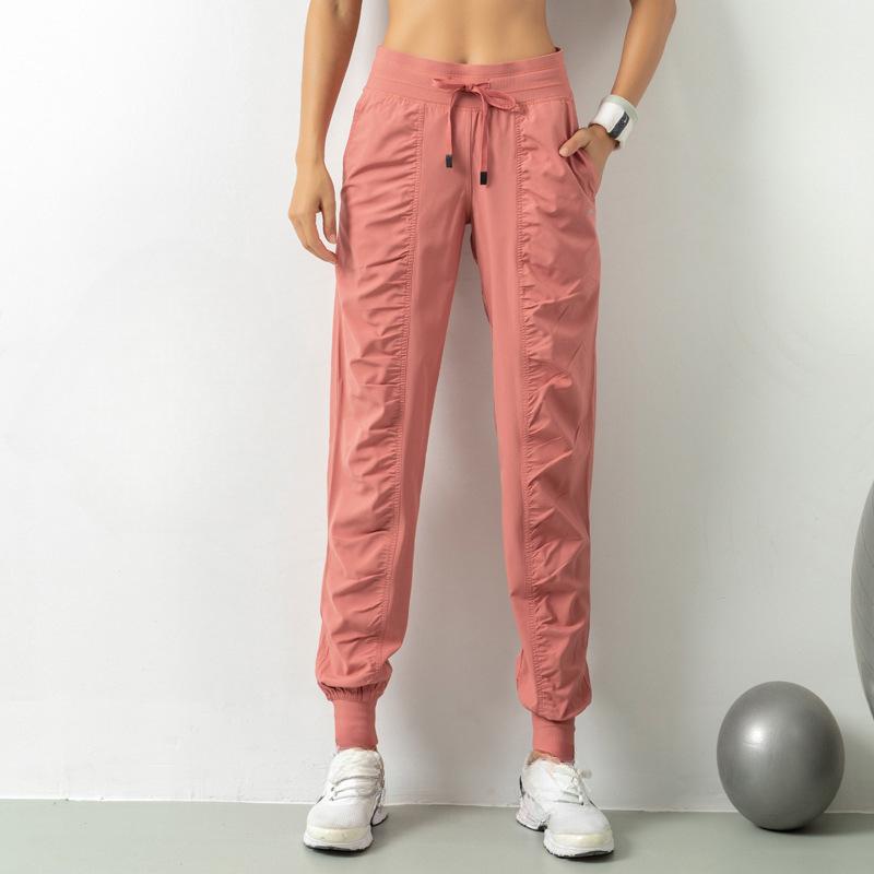 Женские быстросохнущие спортивные брюки-джоггеры с затягивающимся шнурком на талии и боковыми карманами — облегающий крой, дышащая смесь полиэстера для бега и тренировок