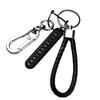 Men’s Leather Cord Keychain with Metal Anti-Lost Phone Tag and Stainless Steel Car Pendant.