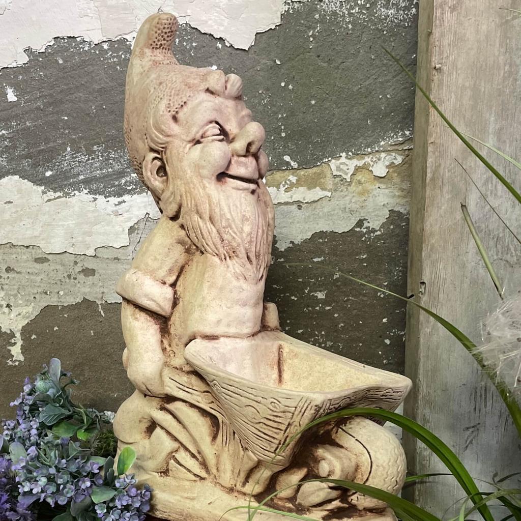 Garden figure dwarf with a wheelbarrow hand-made of concrete