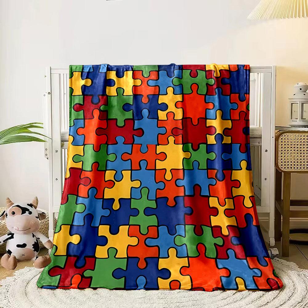 Interlocking colorful puzzle pieces in a random arrangement. for all seasons blanket lunch break throw gift