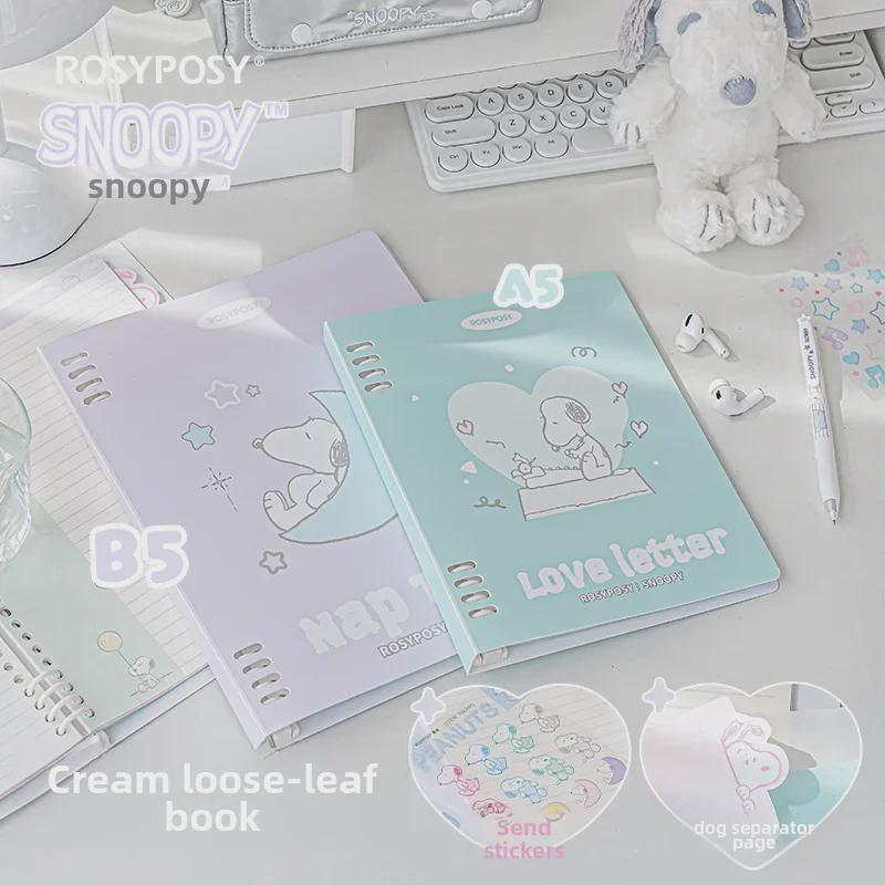 Блокнот в мягкой обложке RosyPosy Snoopy: Кремовый блокнот с цветными страницами, наклейками и горизонтальными линиями.