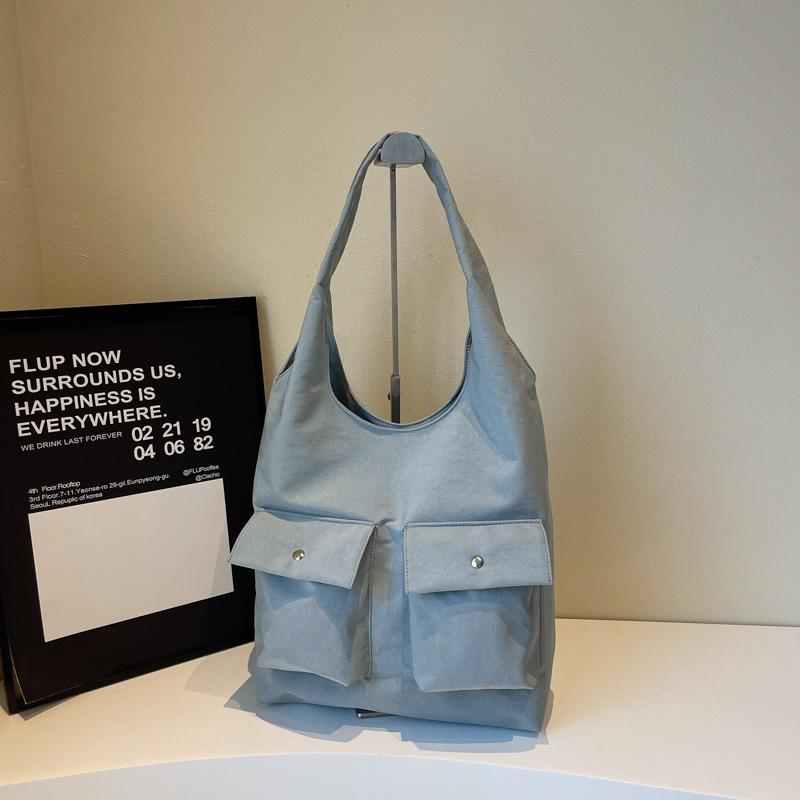 Сумка-тоут через плечо для通勤 2025 новый нишевый дизайн многокарманная тканевая сумка высокого класса портативная сумка подмышку женская