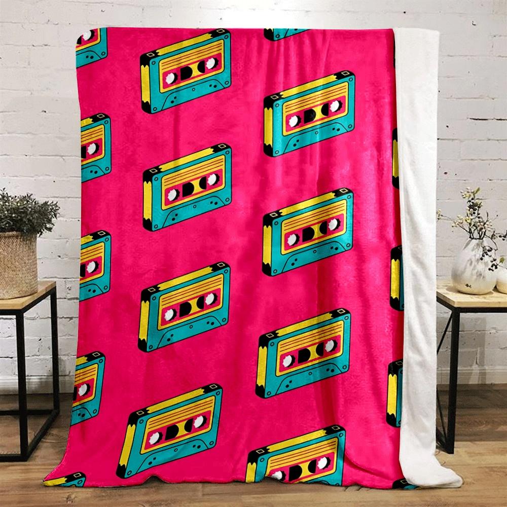 Retro cassette tapes in teal, yellow, and pink arranged diagonally. for all seasons blanket lunch break throw gift