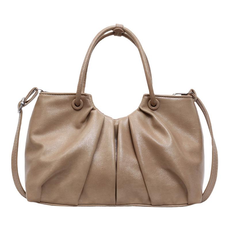 Корейская версия нишевой дизайнерской плиссированной сумки в иностранном стиле, женская универсальная сумка-мессенджер для通勤 из масляной вощеной кожи с чувством стиля