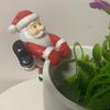 Santa Claus Ornament Resin Decorative Figurine Playful Leaning Pose Flower Pot Statue with Bright Red White Colors Christmas Decor