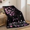 Pink cherry blossoms on branches, with petals falling onto a dark backdrop. for all seasons blanket lunch break throw gift
