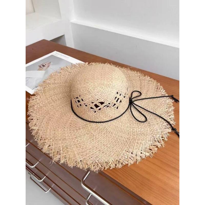 New big brim rough edge Lafite straw hat women's seaside vacation sunscreen photo hat sun hat hollow face hat