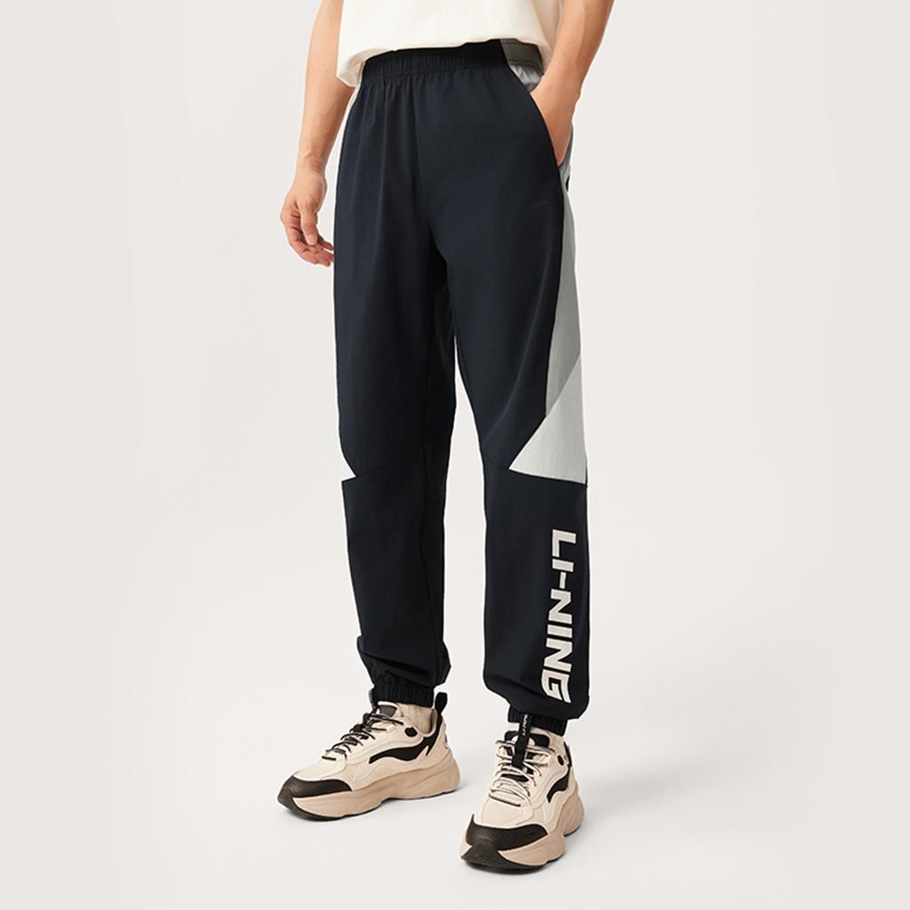 Li Ning Sports Trend Series Повседневные Универсальные Удобные Простые Цветные Блоки Эластичные Трикотажные Спортивные Брюки с Манжетами Мужские Брюки Черные AYKV161-3