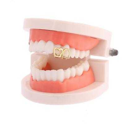 Новые золотые Hip Hop Grillz для зубов Блестящие цирконы Медные зубные украшения Двойное сердце Полое сердце Накладки на зубы Панк-стиль